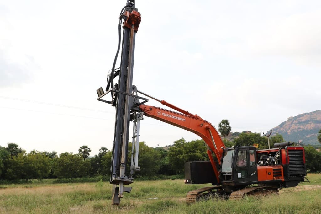 Excavator-Mounted Rotary Drilling Rig (Crawler Exploration Rig) - Tracked Excavator High-Pressure DTH Drill Mast hired by Captain Investments Limited Zambia